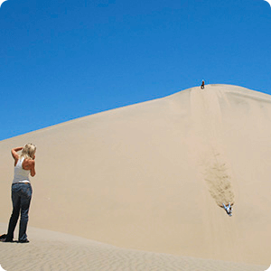 Sandboarding in the Usaka Desert