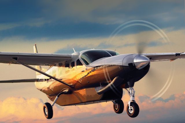 Nazca Lines Day Trip – single-engine aircraft flying over the Peruvian desert at sunset.