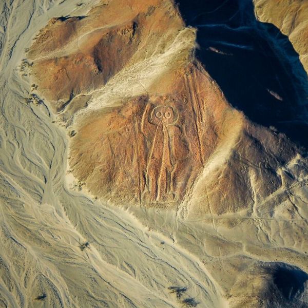 View from the sky of the famous Astronaut figure carved into the hillside near Nazca