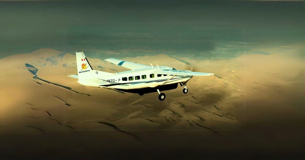 Scenic view of a small Aerodiana aircraft flying over the Peruvian desert during a Nazca Lines flight
