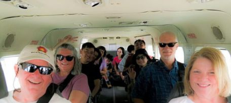 Passengers seated inside Nazca Lines sightseeing aircraft