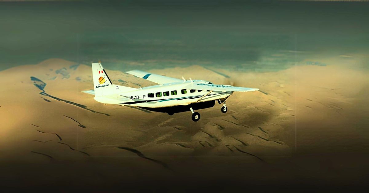 Scenic view of a small Aerodiana aircraft flying over the Peruvian desert during a Nazca Lines flight