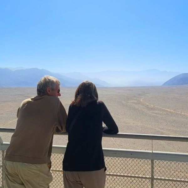 Travelers enjoying the desert view from the Nazca viewing platform
