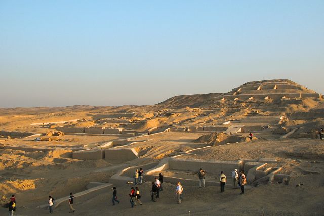 Ancient Cahuachi pyramids in the Nazca desert with tourists exploring the ceremonial site