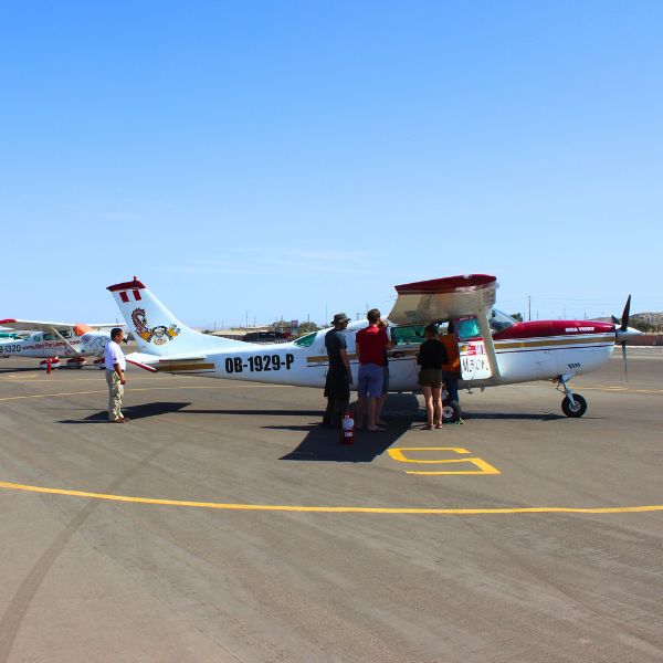 Tourists boarding a Cessna aircraft at Nazca Airport.