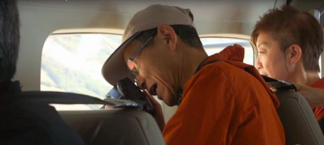 Excited traveler spotting geoglyphs on the Nazca Lines Full Day Trip