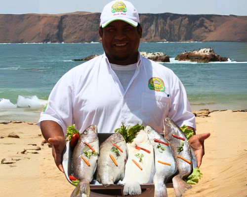 Local chef presenting a fresh seafood platter by the sea