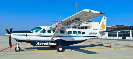 Aerodiana plane on the runway at Pisco Airport, ready for a Nazca Lines flight.