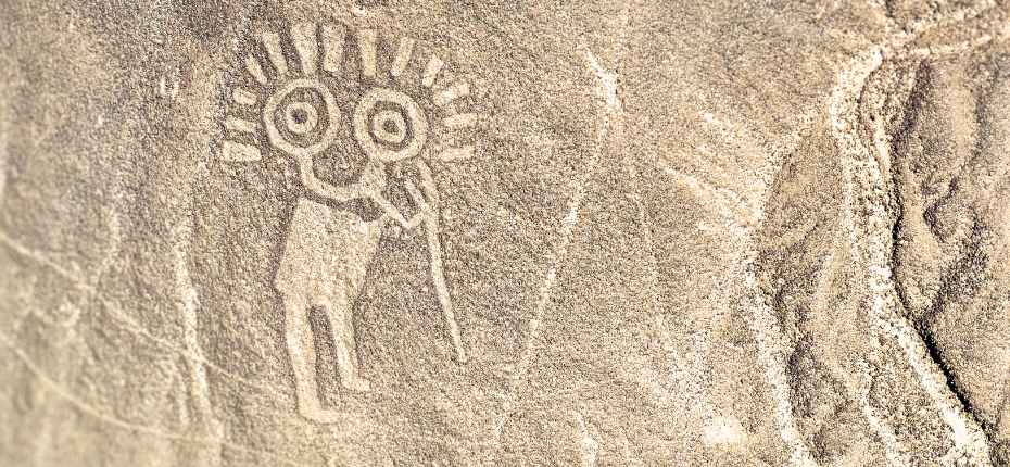 Close-up of an ancient geoglyph carved into stone, part of the Palpa Lines
