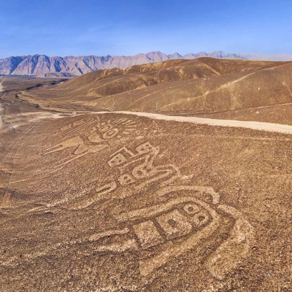 Group of ancient human geoglyphs etched into the Palpa hillsides