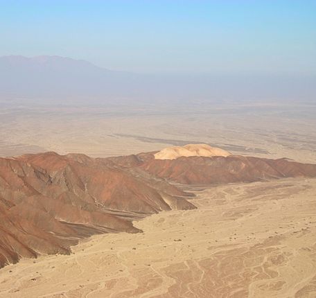 Aerial landscape of the Palpa region with desert hills and ancient pathways