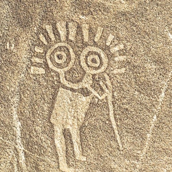 Close-up of a geoglyph with large circular eyes in the Palpa region