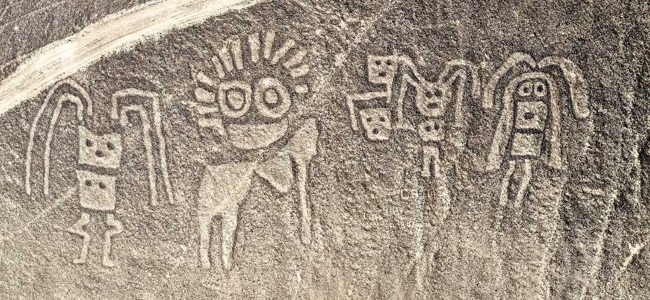 Ancient human-shaped geoglyphs carved into the hillside of Palpa, Peru