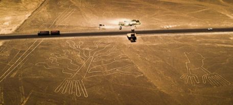 Nazca Lines observation tower with visible tree and hands geoglyphs