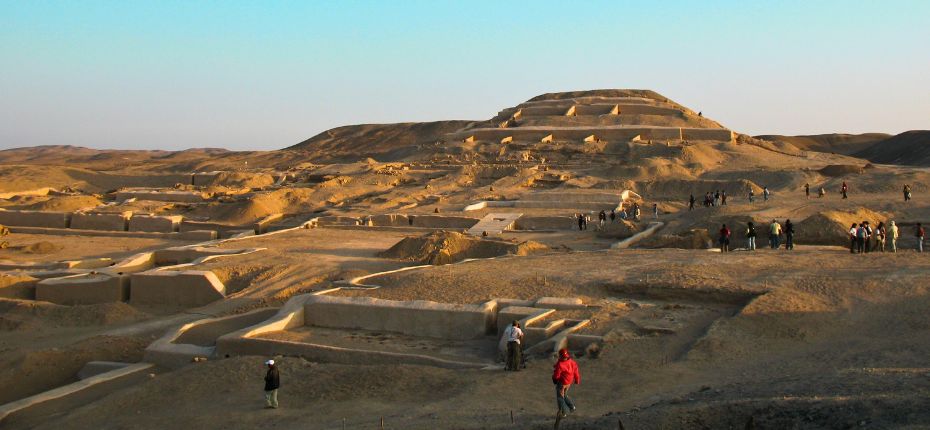 Visitors exploring Cahuachi pyramids at sunset