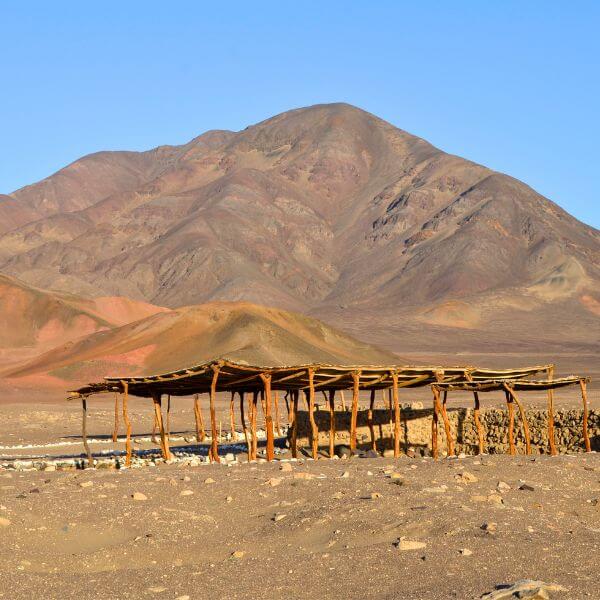 Wooden shelter over tombs at Chauchilla Cemetery